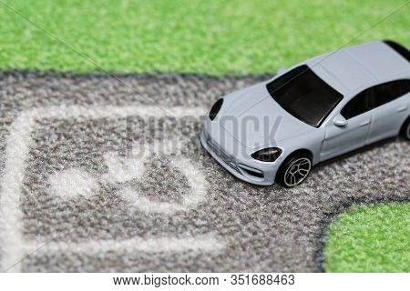 Lubartow, Poland - 20 November 2019: Toy Car Is Parking On Disabled Parking Place On Car City Carpet