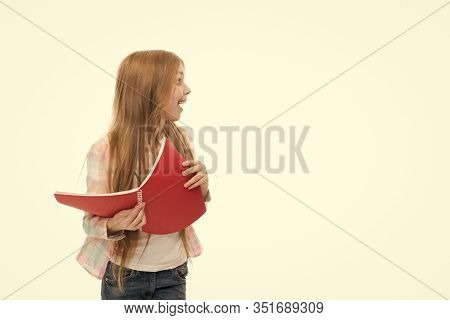 Back To School Goods. Cute Little Girl Holding School Exercise Book. Adorable Small School Child Wit