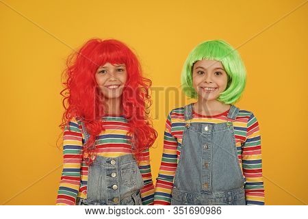 Happy Little Girls Smiling Faces. Anime Fan. Cheerful Friends In Bright Colorful Wigs. Anime Cosplay