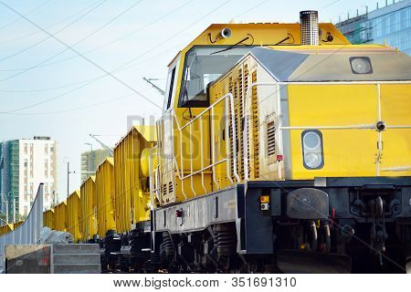 Cargo Train At The Station In City