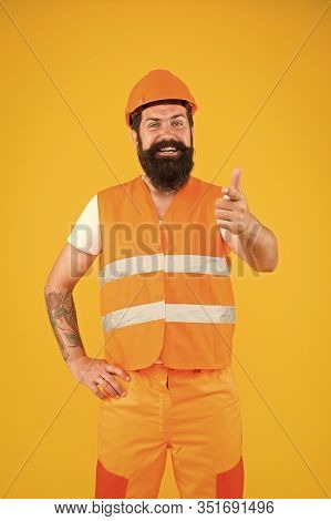 My Work Will Be Sure To Impress. Construction Worker In Work Clothes Pointing Finger On Yellow Backg