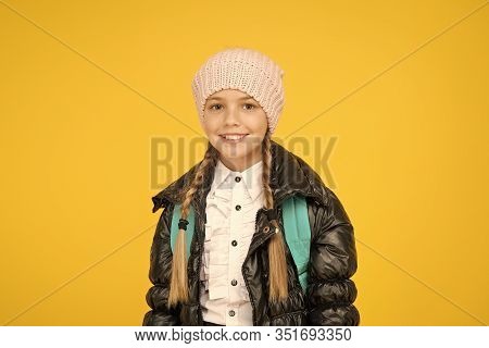 Future Focused Learning. Happy Little Schoolgirl Smiling On Yellow Background. Small Child In Autumn