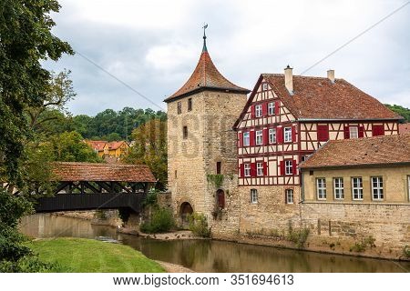 Wooden Covered Bridge And Old Tower In The Historic Center Of Schw Bisch Hall On The Kocher River, B