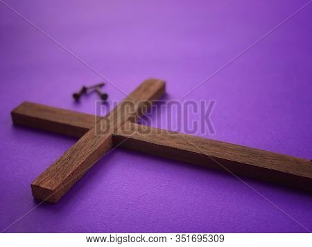 Good Friday, Lent Season, And Holy Week Concept. A Christian Cross And A Blurry Image Of Three Rusty