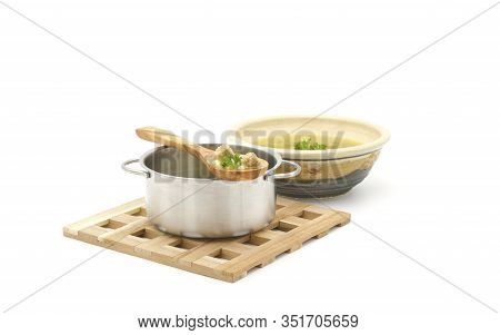 Homemade Italian Wedding Soup On A Wooden Spoon From The Pot Photographed On A White Background With
