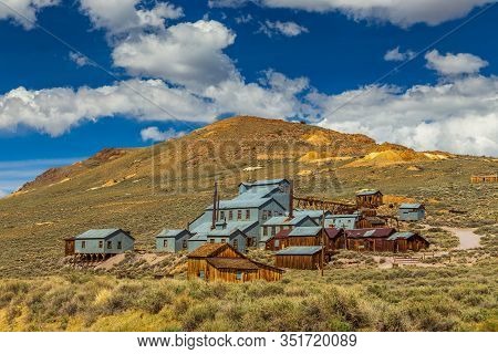 View Of The Bodie, Ghost Town. Bodie State Historic Park. Abandoned Wooden Houses And Standard Conso