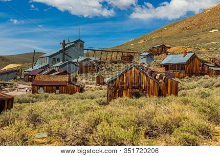 View Of The Bodie, Ghost Town. Bodie State Historic Park. Abandoned Wooden Houses And Standard Conso