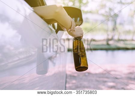 Drunk Asian Woman Drinking Alcohol While Driving Car On Road,women Drive Her Car With A Bottle Of Be