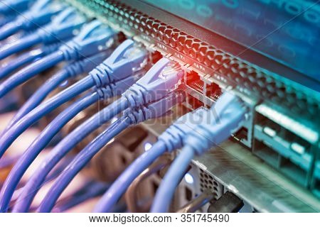 network cable connecting on network core switch close up