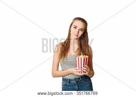 Beautiful Blonde Girl Eat Popcorn And Watch Comedia Movie Isolated On White Background. Copy Space, 