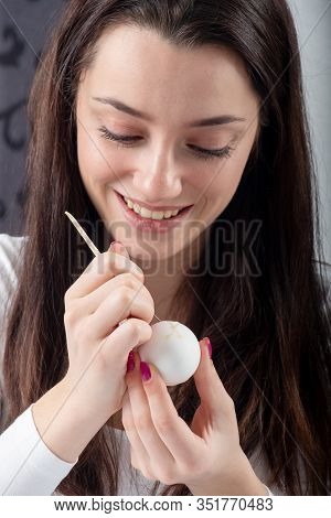 Young Beautiful Sexy German Woman Paints A White Easter Egg According To Sorbian Tradition With A Ne