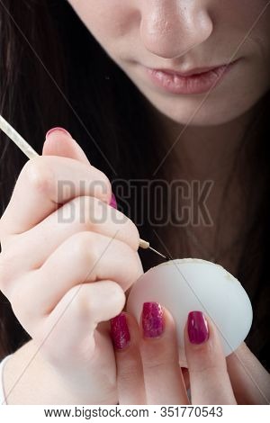 Young Beautiful Sexy German Woman Paints A White Easter Egg According To Sorbian Tradition With A Ne