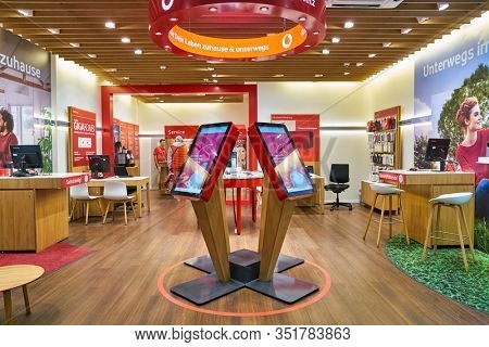 BERLIN, GERMANY - SEPTEMBER 20, 2019: interior shot of Vodafone Shop in Berlin. Vodafone Group plc is a multinational telecommunications company.