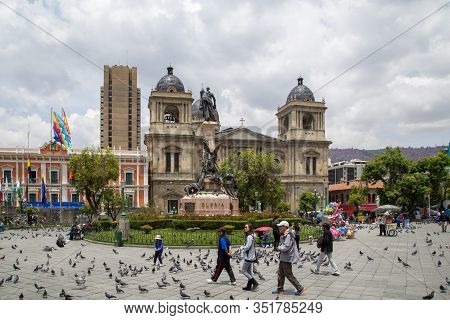 La Paz, Bolivia - October 24, 2015: People On Plaza Murillo With The Cathedral In The Background.