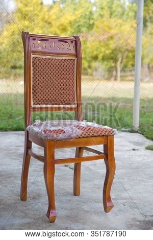 C Lassic Brown Chair. Wooden Chair Green Background . Old Chair On Nature Background . Old Style Woo