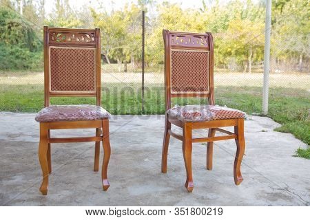 C Lassic Brown Chair. Wooden Chair Green Background . Old Chair On Nature Background . Old Style Woo