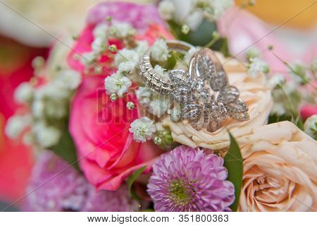 Close Up Wedding Ring On Top Of A Colorfull Bouquet. . Macro .close Up Of Wedding Rings On The Bouqu