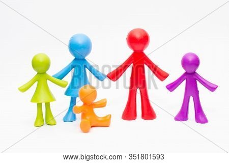 Concept Of A Traditional Family With Children, Colorful Meeples Isolated On White