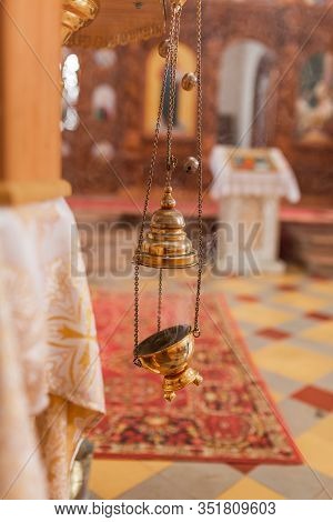 A Priest's Censer Hanging In The Orthodox Church. Copper Incense With Burning Coal Inside.