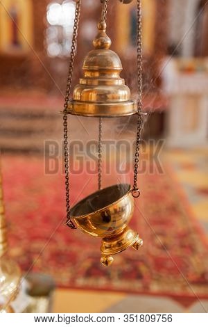 A Priest's Censer Hanging In The Orthodox Church. Copper Incense With Burning Coal Inside.