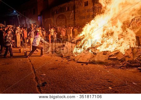 Vrindavan, India - March 20, 2019: People Pulling Out Coal Denoting The Mythical Figure Of Prahlad F
