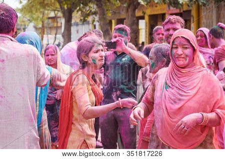 Vrindavan, India - March 21, 2019: Indian People In Different Colours Celebrate Traditional Holi Fes