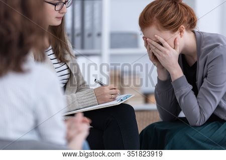 Sad Woman Crying During Psychotherapy At Professional Clinic