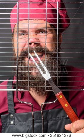 Chef Man With Bbq Cooking Tools. Bbq Party. Barbecue Accessories. Chief Cook In Workwear With Utensi
