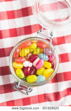 Fruity jellybeans. Tasty colorful jelly beans in glass jar.