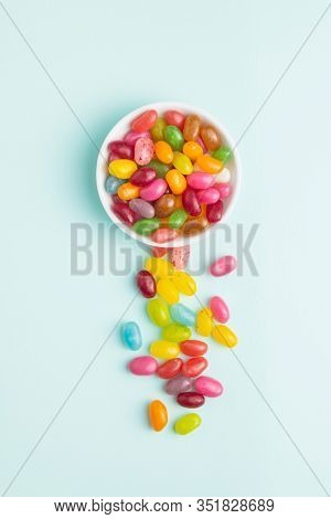Fruity jellybeans. Tasty colorful jelly beans on colorful background.
