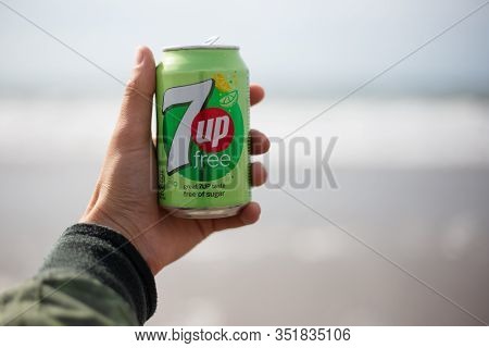 The Hague, Netherlands - 09.06.2019: Young Man Holding A Bank Of New 7up Free.