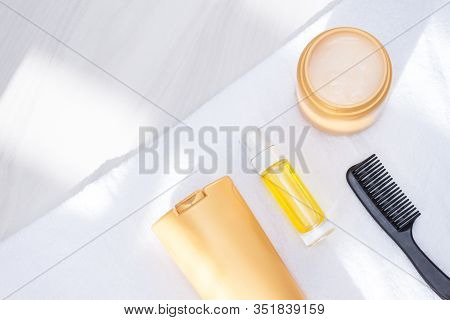 Body And Hair Care Prodacts, Toiletries With Towel, Sunlight On White Background. Care And Clean Con
