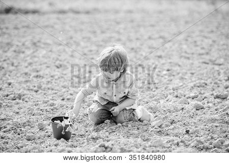 Happy Child Gardener. Botanic Worker. Spring Season. Earth Day. New Life. Summer Farm. Small Kid Pla