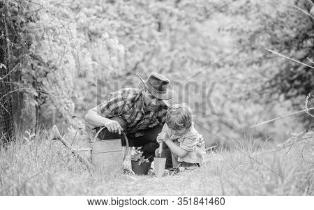 Gardening Tools. Planting Flowers. Dad Teaching Little Son Care Plants. Little Helper In Garden. Mak