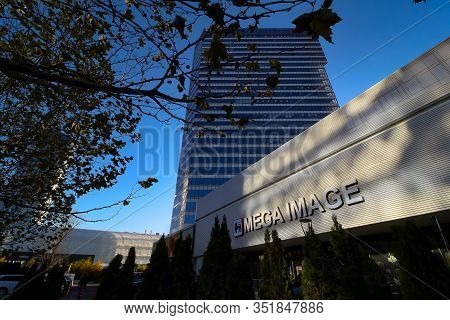 Bucharest, Romania - December 09, 2019: A Patch Of Light Falls On The Front Of The Mega Image Concep