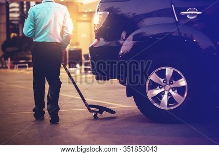 Security Personnel Are Checking Safty Under The Car. Befor Entering The Hotel Parking Lot.