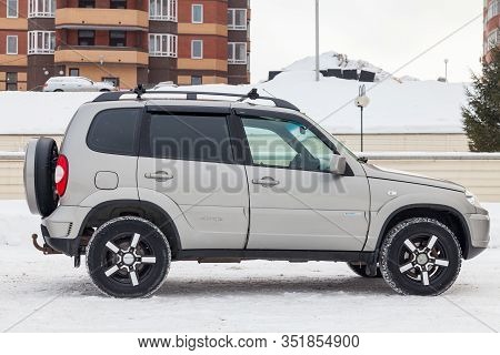 Novosibirsk, Russia - 02.18.2020: Side View Of A Chevrolet Niva, A Russian-american Car In The Snow 