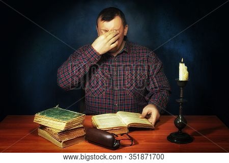 The Man Reads The Book. In The Head Images Similar To Reality Are Born. Fascinating Literary Work. T