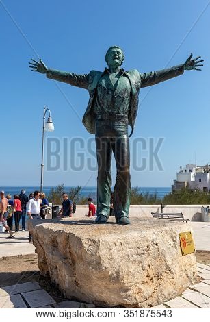 Polignano A Mare, Italy - Sept 17, 2019: Statue Of The Italian Singer And Songwriter Domenico Modugn