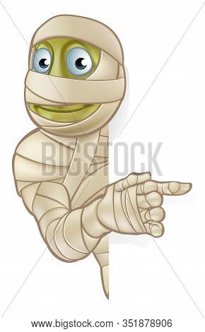A Cartoon Halloween Mummy Character Peeking Around And Pointing At A Sign