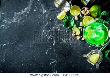 Strong Alcohol Cocktail. Absinth And Vodka Martini Drink With Sugar, Ice Cubes And Lime, With Ingred