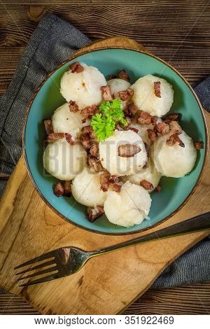 Meat Stuffed Potato Dumplings With Fried Onion And Greaves.