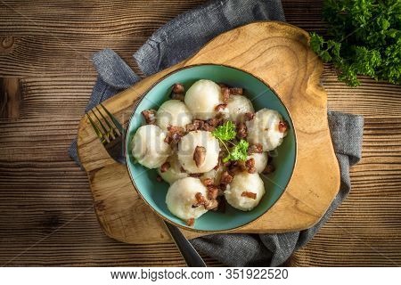 Meat Stuffed Potato Dumplings With Fried Onion And Greaves.