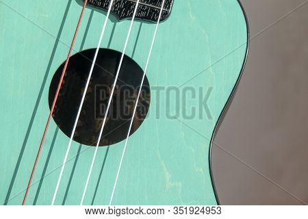 Close Up Of A Part Of Ukelele Guitar.