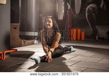 Balance. Young Muscular Caucasian Woman Practicing In Gym With Equipment. Athletic Female Model Doin