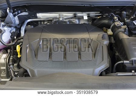 The Engine Compartment Of A Modern Car. View Of The Engine Compartment Of A New Car.