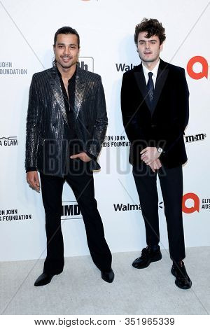 LOS ANGELES - FEB 9:  Andrewi GIllott, Duke Nicholson at the 28th Elton John Aids Foundation Viewing Party at the West Hollywood Park on February 9, 2020 in West Hollywood, CA