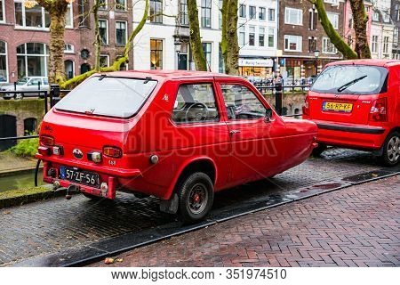 Utrecht, Netherlands - January 08, 2020. Old Three Wheels Red Car Reliant Robin