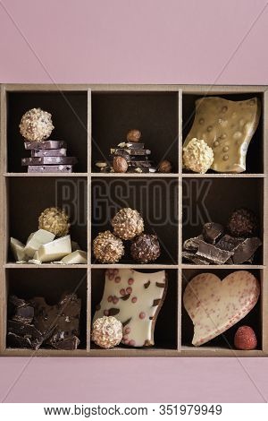 Swiss Chocolate Mix And Tasty Pralines In A Box. Different Types Of Chocolate And Pralines In A Box 