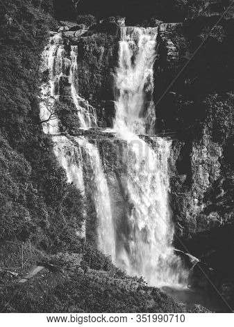 Black And White Image Of Big Powerfull Waterfall In The Mountains At Jungle Forest